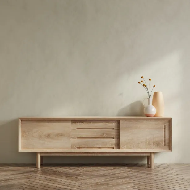 Services Une armoire en bois avec un vase sur le dessus
